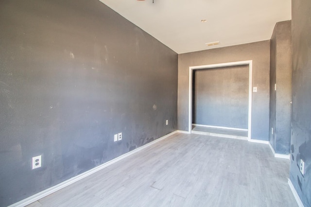 unfurnished bedroom featuring light wood-type flooring