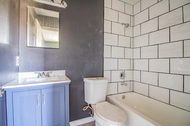 full bathroom with vanity, tiled shower / bath, and toilet