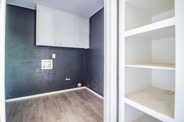 laundry area with hookup for a washing machine and light wood-type flooring