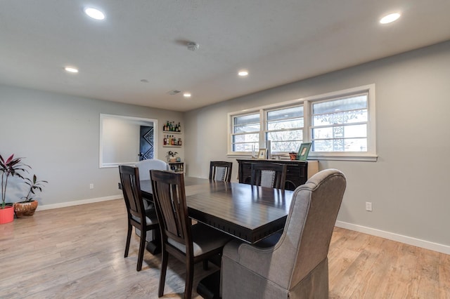 dining space featuring light hardwood / wood-style floors