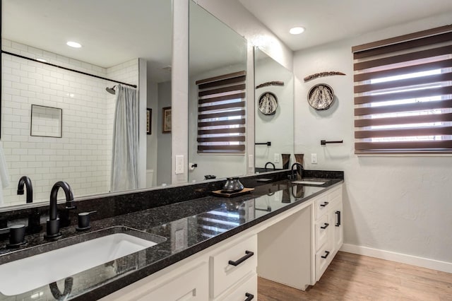 bathroom featuring hardwood / wood-style flooring and vanity