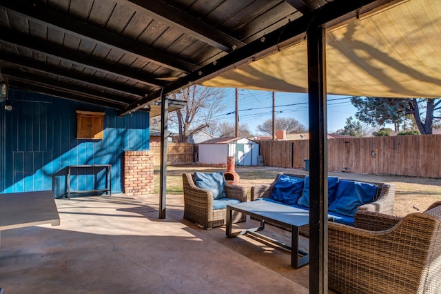 view of patio / terrace with a storage shed and outdoor lounge area