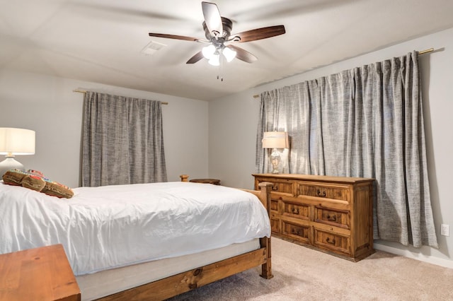 bedroom featuring ceiling fan and carpet