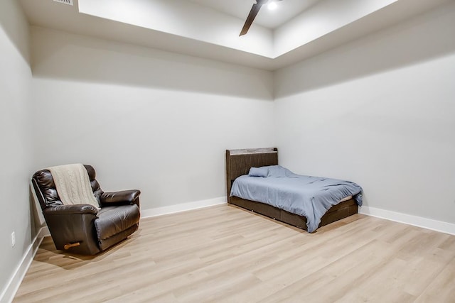 bedroom with ceiling fan and light hardwood / wood-style flooring