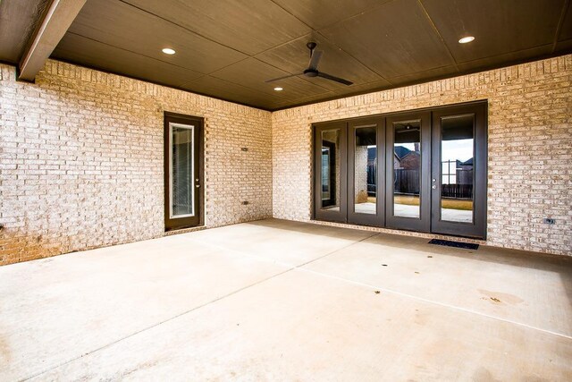 view of patio with french doors and ceiling fan