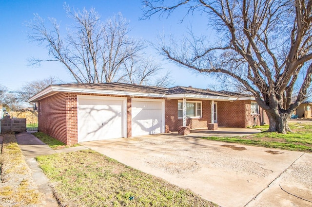 ranch-style house featuring brick siding, an attached garage, fence, and concrete driveway