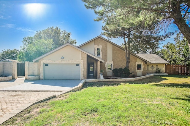 view of front of property with a garage and a front yard