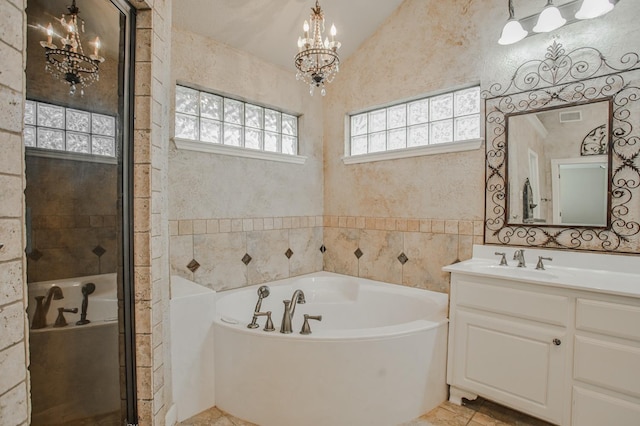 bathroom featuring vanity, plus walk in shower, and a chandelier