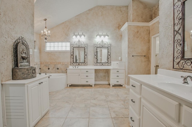 bathroom featuring lofted ceiling, vanity, a chandelier, and a bathing tub