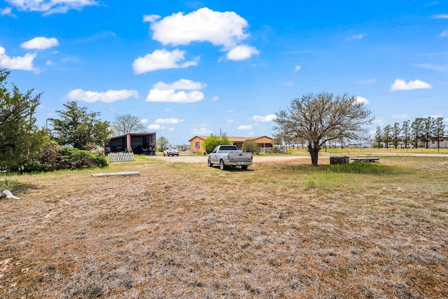view of yard featuring a carport