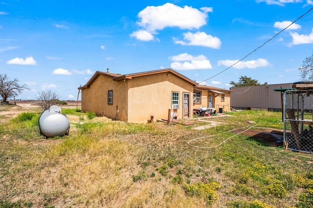 view of side of property featuring stucco siding