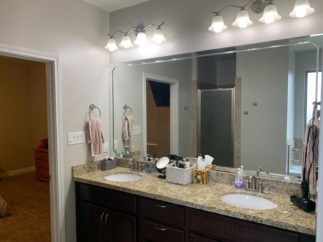 bathroom with an enclosed shower and vanity