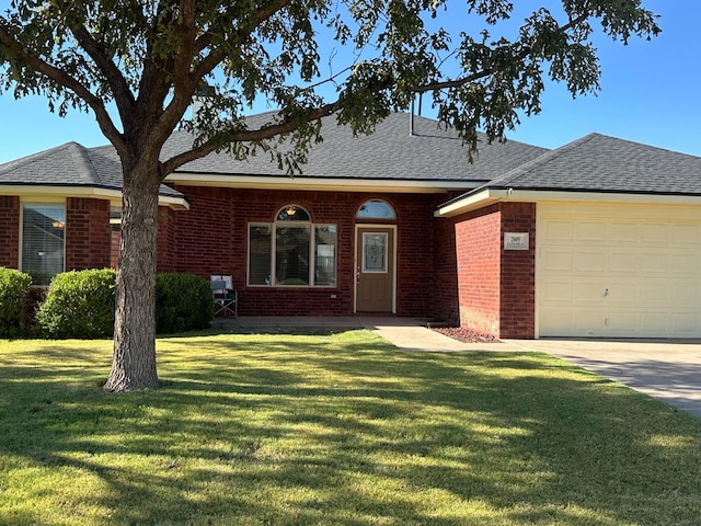 ranch-style home with a garage and a front lawn