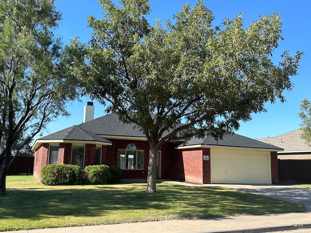 single story home featuring a garage and a front yard