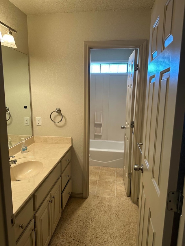 bathroom featuring vanity and a textured ceiling