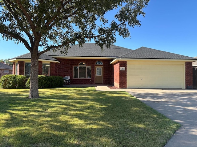 ranch-style house featuring a garage and a front lawn