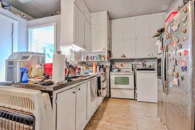 kitchen featuring white electric stove, white cabinetry, washer / dryer, and stainless steel refrigerator with ice dispenser