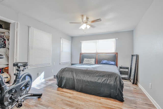 bedroom with ceiling fan and light wood-type flooring