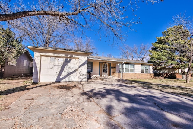 single story home with a garage