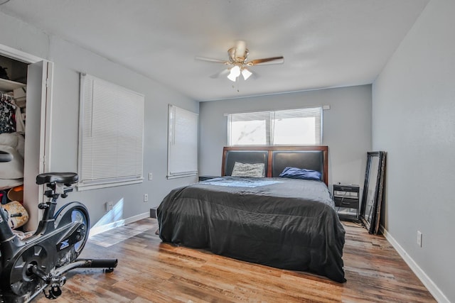 bedroom featuring wood-type flooring and ceiling fan