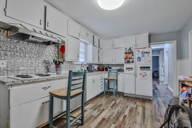 kitchen featuring white cabinetry, white appliances, and light hardwood / wood-style floors