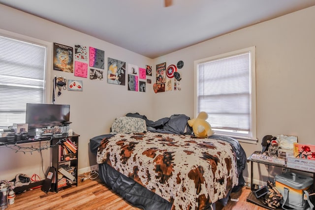 bedroom with hardwood / wood-style flooring