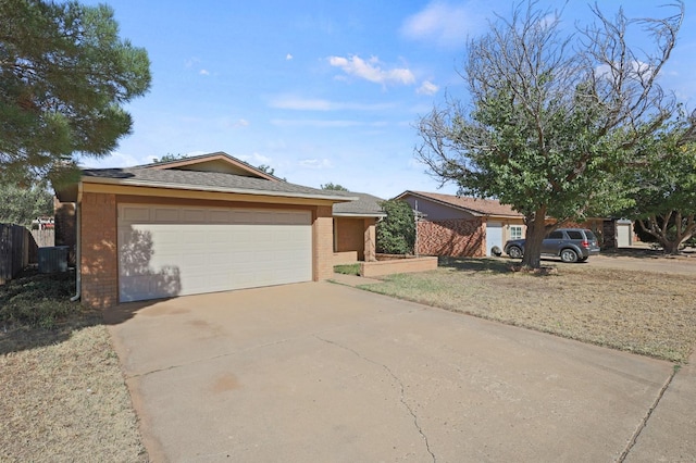 ranch-style home featuring a garage