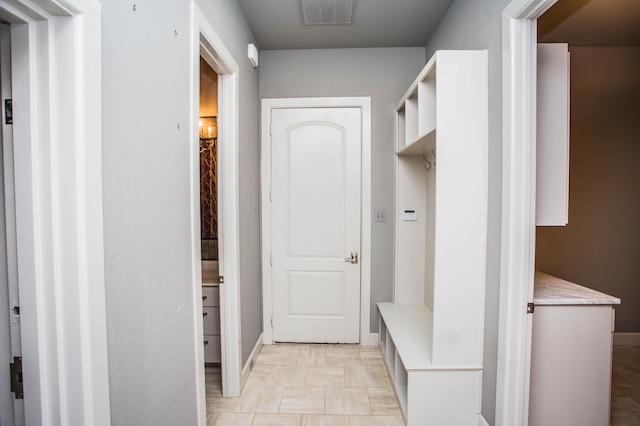 mudroom with visible vents and baseboards