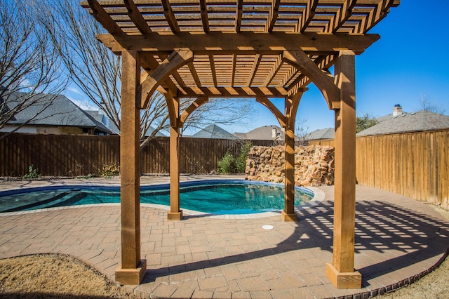 view of pool featuring a patio area, a fenced backyard, a fenced in pool, and a pergola