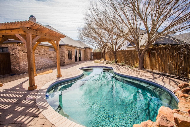 view of swimming pool featuring a patio area, a fenced backyard, and a fenced in pool