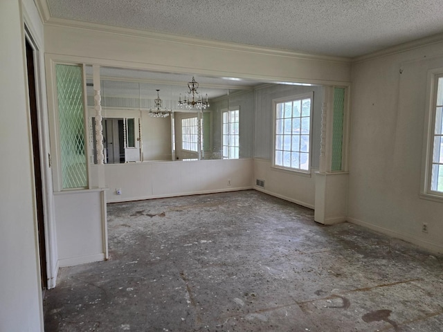 unfurnished dining area with crown molding, a notable chandelier, and a textured ceiling