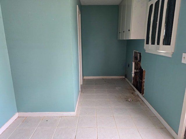 laundry area featuring light tile patterned floors