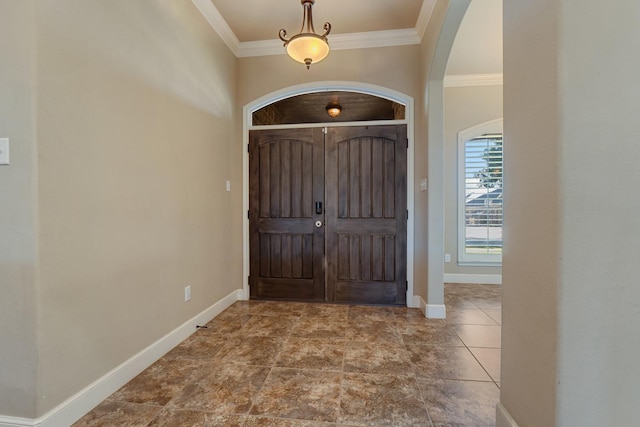 entryway featuring ornamental molding