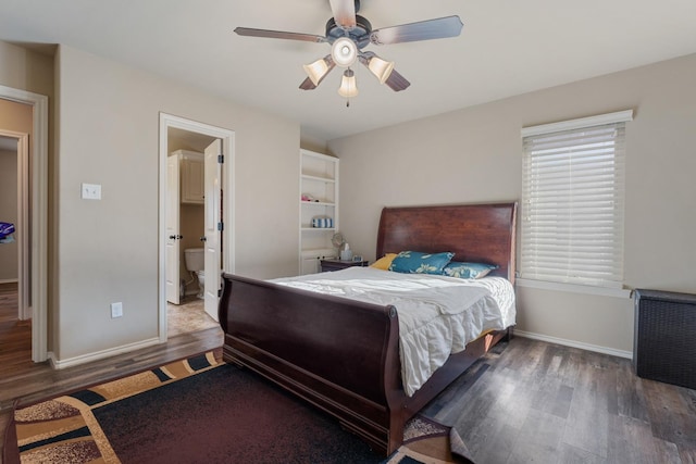 bedroom featuring ensuite bathroom, dark wood-type flooring, and ceiling fan