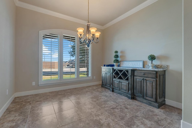 dining room featuring ornamental molding and a notable chandelier