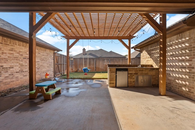 view of patio / terrace featuring area for grilling and a pergola