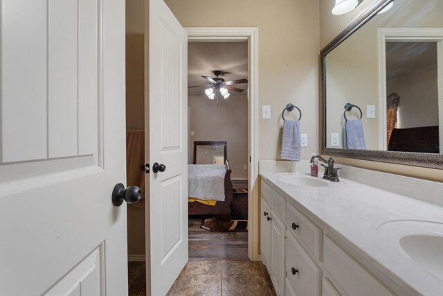 bathroom with ceiling fan, vanity, and tile patterned floors