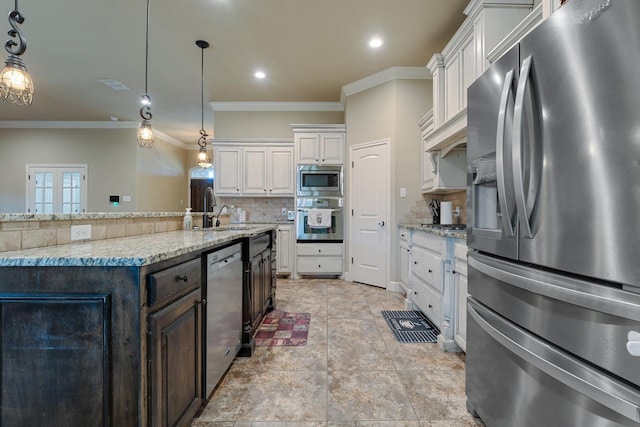 kitchen with a spacious island, dark brown cabinetry, decorative light fixtures, appliances with stainless steel finishes, and white cabinets