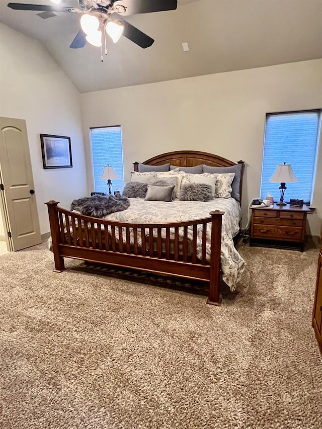 bedroom featuring vaulted ceiling, carpet floors, and ceiling fan