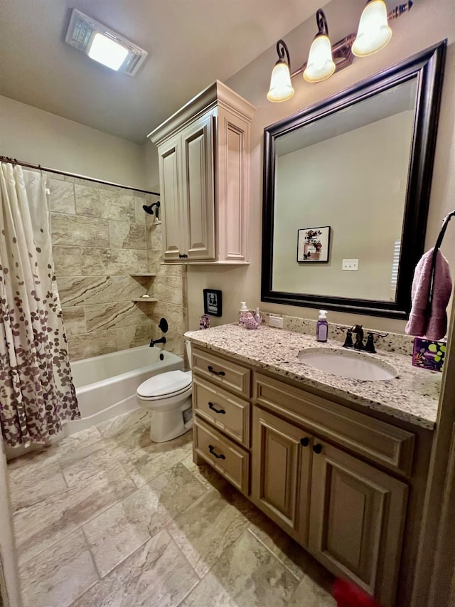 full bathroom with shower / bath combo, vanity, and toilet