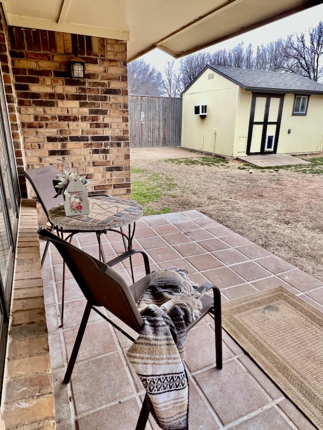 view of patio featuring fence