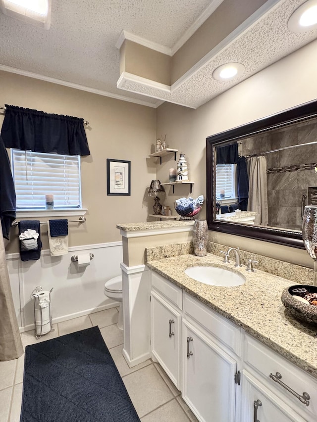 bathroom with ornamental molding, tile patterned flooring, a textured ceiling, and toilet