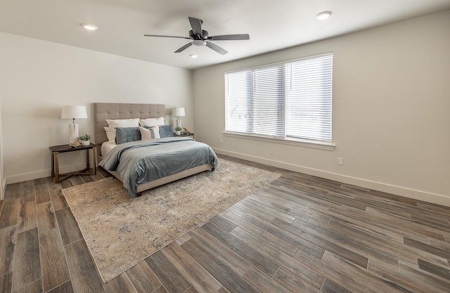 bedroom with a ceiling fan, recessed lighting, wood finished floors, and baseboards