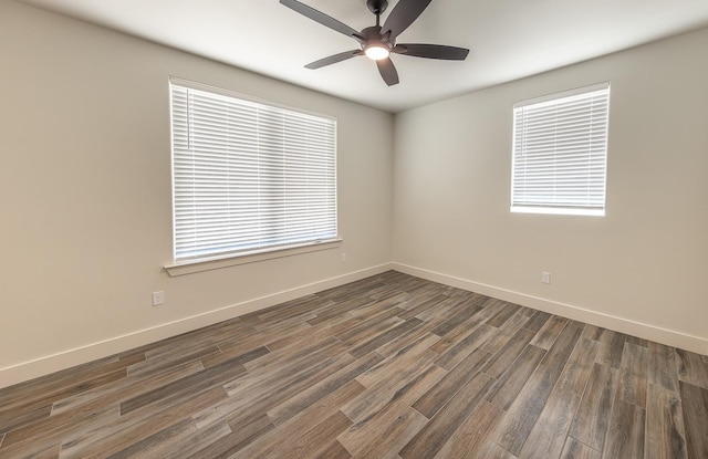 unfurnished room with baseboards, a ceiling fan, and wood finished floors