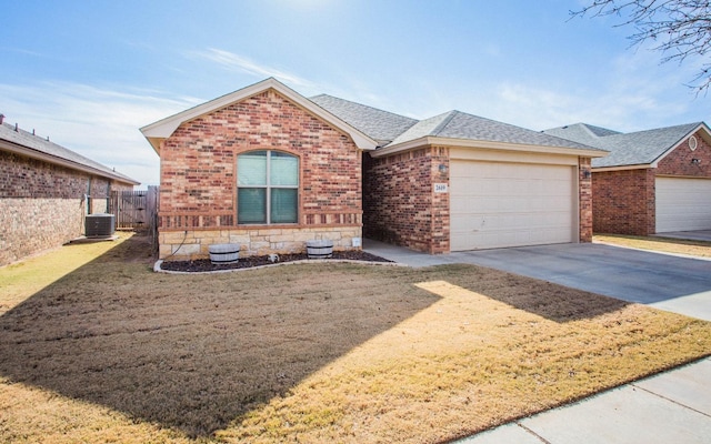 view of front of house with a garage and central AC unit