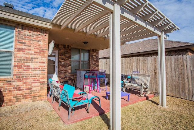 view of patio featuring a bar and a pergola