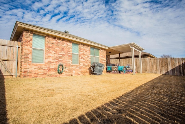 back of house featuring a pergola