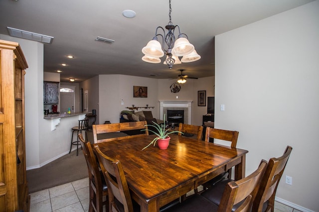 tiled dining room featuring ceiling fan