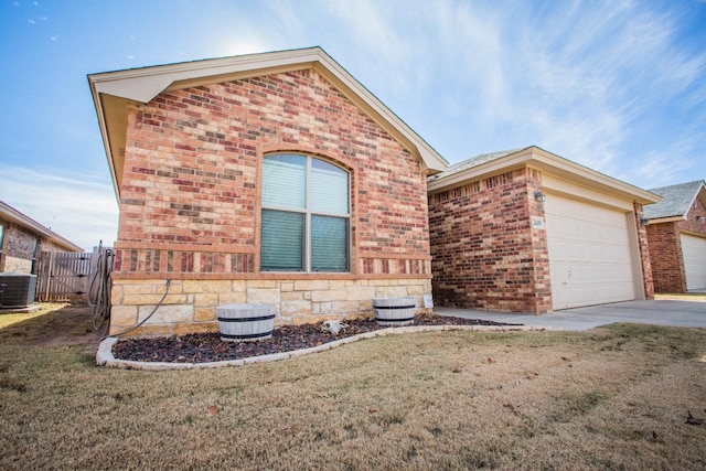 view of front of home featuring a front yard and central air condition unit