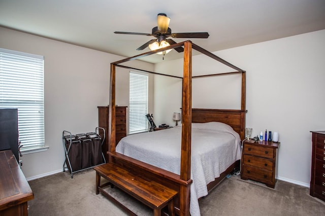 bedroom with dark colored carpet and ceiling fan